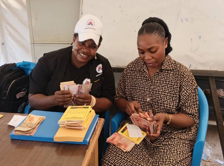 giving out money to the members who where in need of it